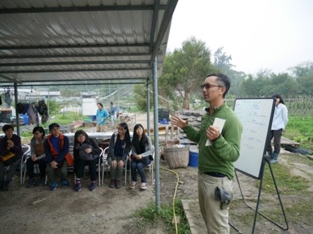 Instructor introducing the features of an organic farm