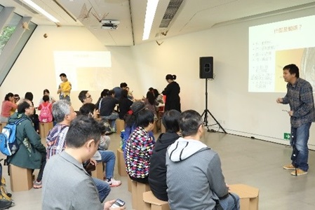 Audience sitting comfortably on the paper chairs