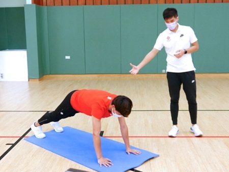 PolyU instructor and student in exercise demonstration