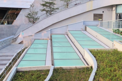 Screen-printable self-cleaning coating is applied over the skylight