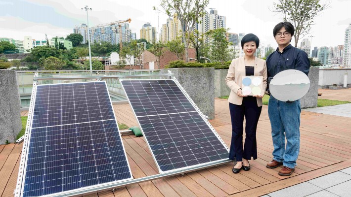 A research team led by Prof. Vivien Lu Lin (left), along with key team member Dr Gong Quan, has invented a carbon dots-driven SARC coating for cooling and energy saving in buildings.