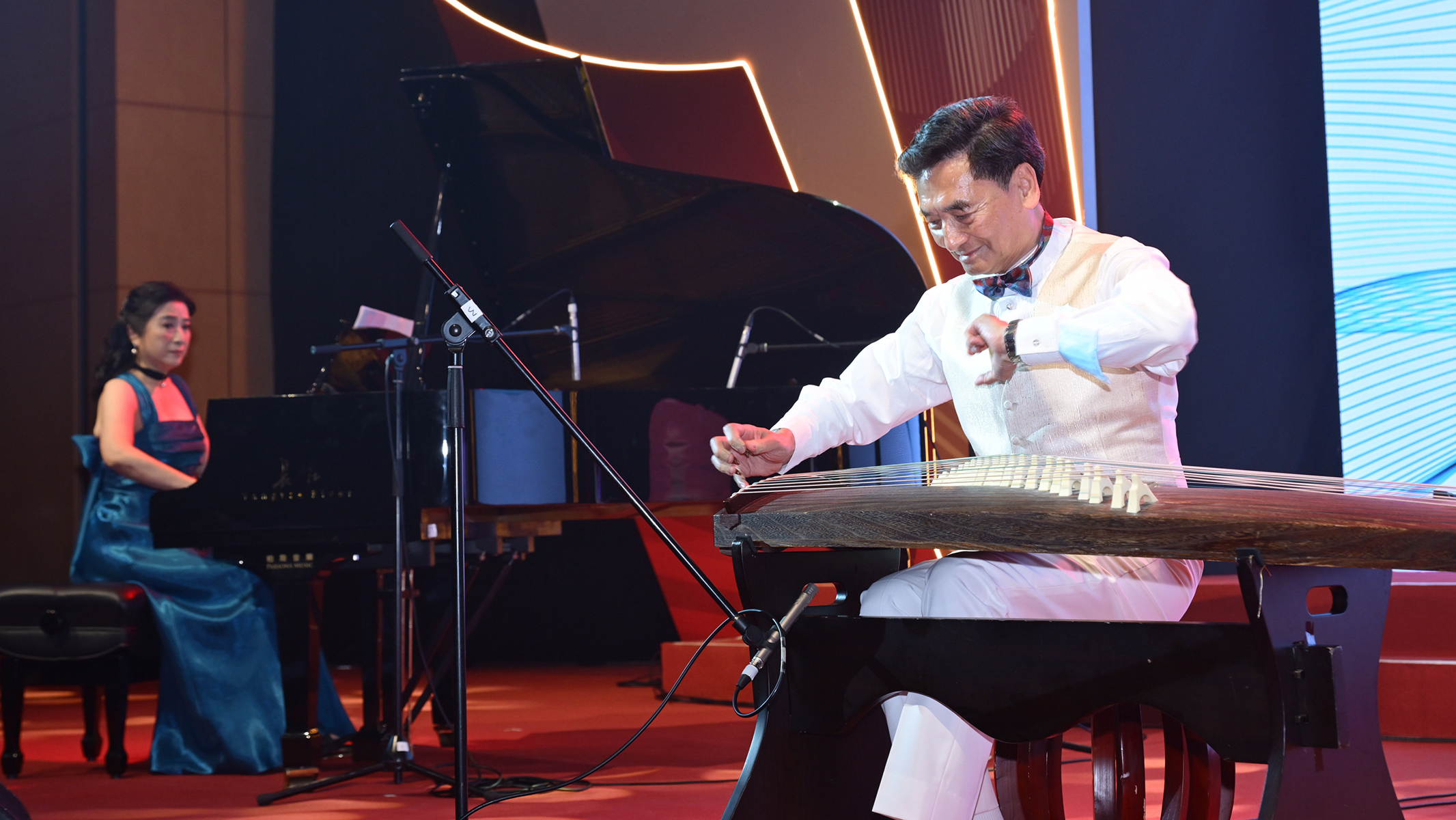 Dr Raymond Chan presented an enchanting piano and guzheng duo with renowned pianist Dr Vivian Cheng (left).