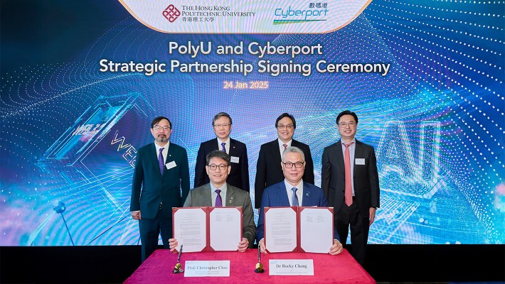 PolyU and Cyberport signed an MoU to establish a strategic partnership. Witnessed by Mr Simon Chan, Chairman of Cyberport (2nd from right, back row); Prof. Jin-Guang Teng, PolyU President (2nd from left, back row); Ir Arthur Lee, PolyU Council Member and Chairman of PolyU Knowledge Transfer Committee (left, back row) and Mr Hendrick Sin, Chairman of the Cyberport Investors Network Steering Group (right, back row), the MoU was signed by Dr Rocky Cheng, CEO of Cyberport (right, seated) and Prof. Christopher Chao, PolyU Vice President (Research and Innovation) (left, seated).